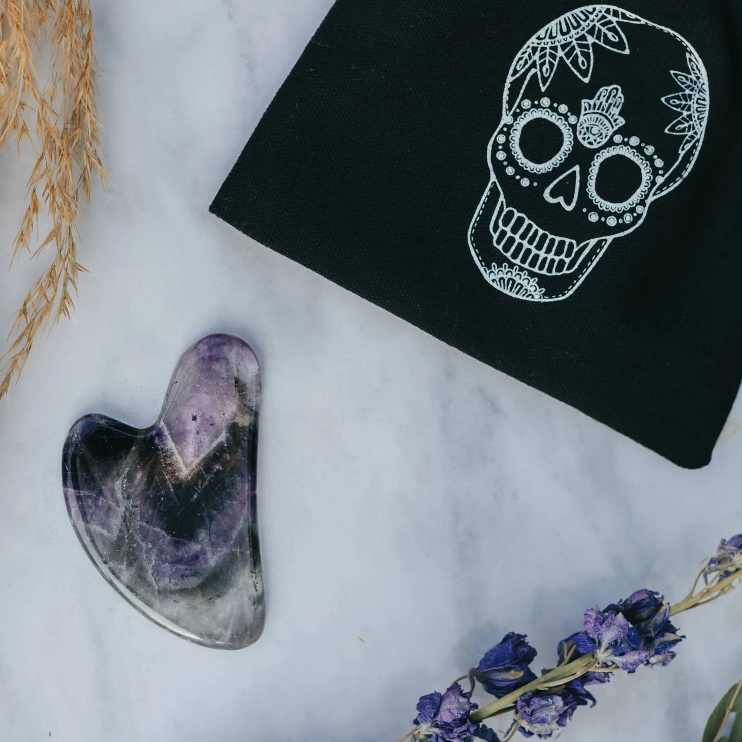 Shadowed Serenity: Amethyst Crystal Gua Sha with Black Skull Pouch